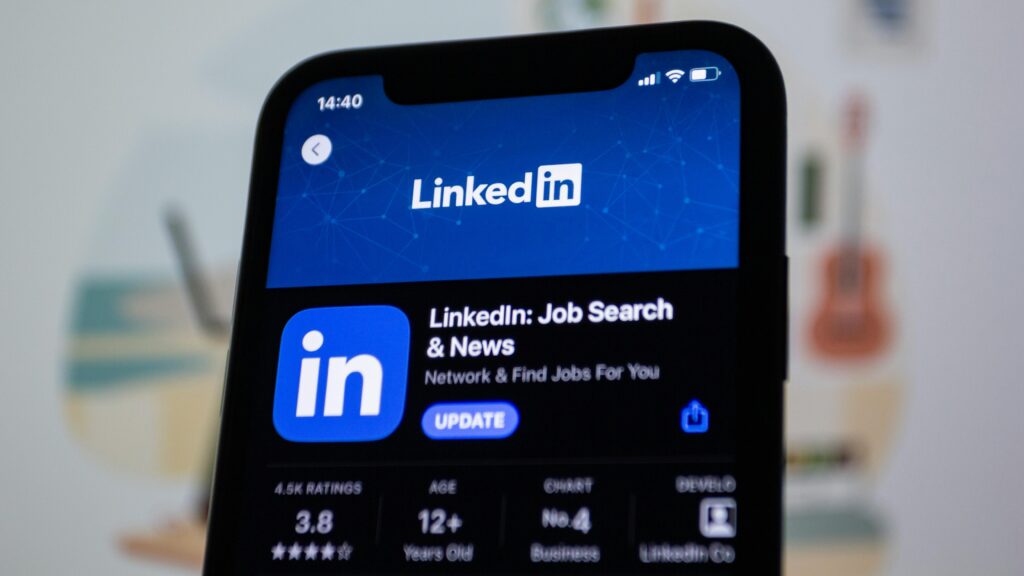 LinkedIn app interface on smartphone screen, highlighting job search tools and updates for the modern job seeker.